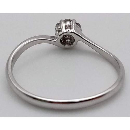 78 - A 9K White Gold Diamond Solitaire Ring. Size Q. 0.15ct.
1.4g total weight.