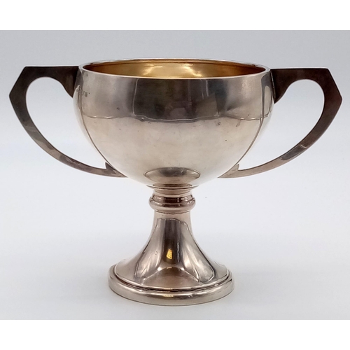 66 - A Vintage Solid Silver Football Trophy. Hallmarks for Birmingham. 166g. 13cm tall.