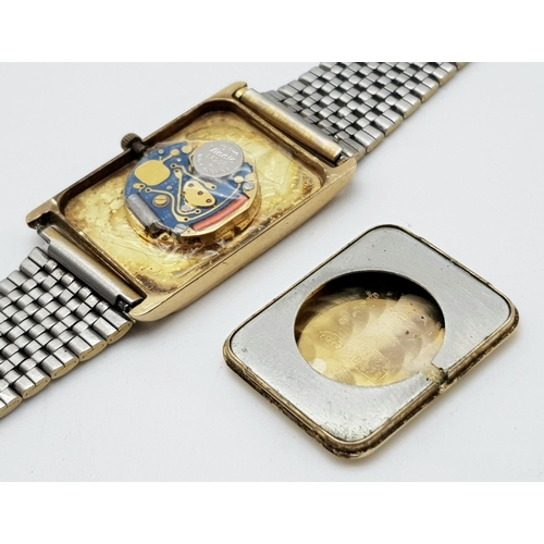 838 - A Vintage Avia 9K Gold Cased Watch. Gilded strap. Gold rectangular case - 33 x 23mm. Dial is worn on... 