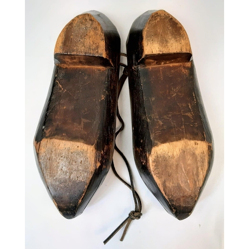 375 - Pair of Dutch clogs that have been crudely engraved by a German soldier to mark the successful invas... 