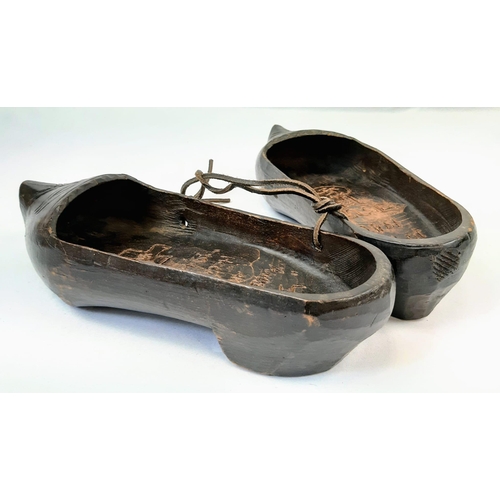 375 - Pair of Dutch clogs that have been crudely engraved by a German soldier to mark the successful invas... 