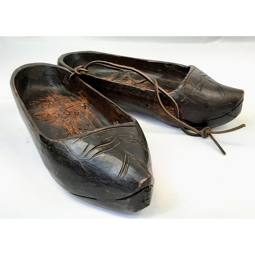 375 - Pair of Dutch clogs that have been crudely engraved by a German soldier to mark the successful invas... 