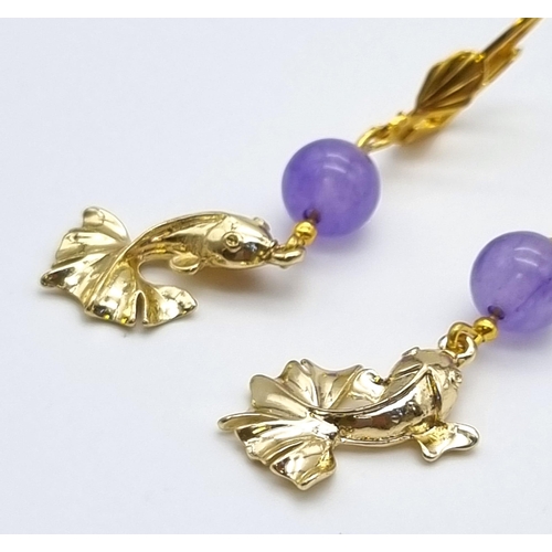 802 - A Pair of 18K Gold Plated Lavender Jade and Leaping Fish Lever-Back Earrings.