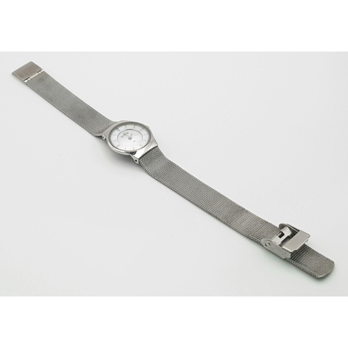 816 - A Skagen of Denmark Stainless Steel Ladies Quartz Watch. Case - 25mm. White dial. In good condition ... 