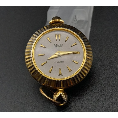 830 - A Vintage Miniature Gruen Watch Pendant or Charm. Gilded and enamel decoration. Mechanical movement.... 