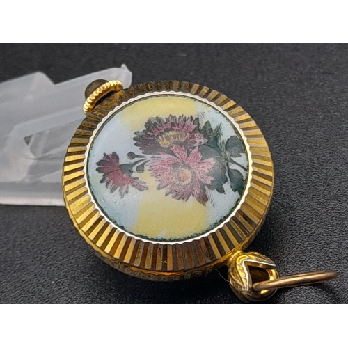 830 - A Vintage Miniature Gruen Watch Pendant or Charm. Gilded and enamel decoration. Mechanical movement.... 