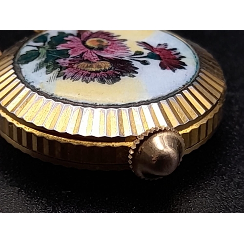 830 - A Vintage Miniature Gruen Watch Pendant or Charm. Gilded and enamel decoration. Mechanical movement.... 