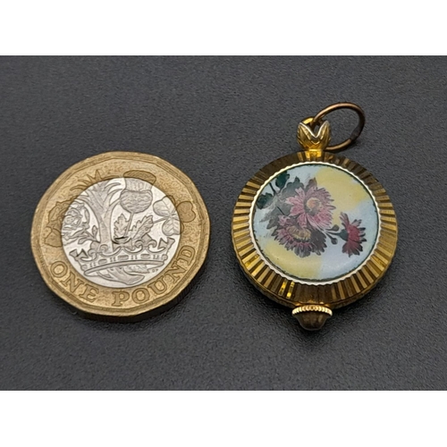 830 - A Vintage Miniature Gruen Watch Pendant or Charm. Gilded and enamel decoration. Mechanical movement.... 