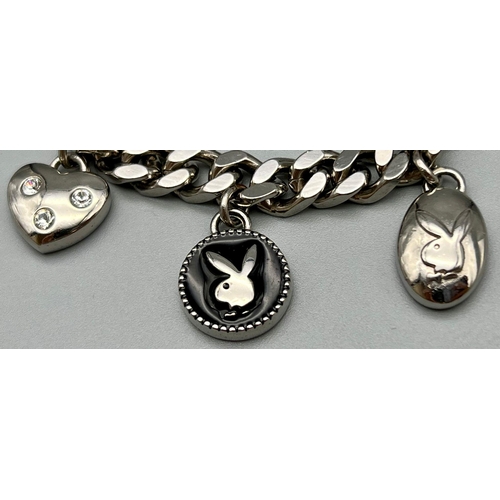 1062 - A Playboy White Metal Charm Bracelet with a Playboy charm clock - in working order. 16cm