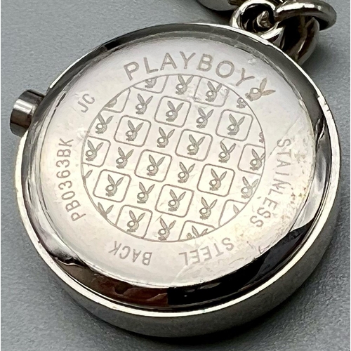 1062 - A Playboy White Metal Charm Bracelet with a Playboy charm clock - in working order. 16cm