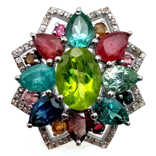 1069 - A Peridot Gemstone Ring with Peridot 2.45ct - with a halo of diamonds .50ct and Tourmalines 3.50ct. ... 