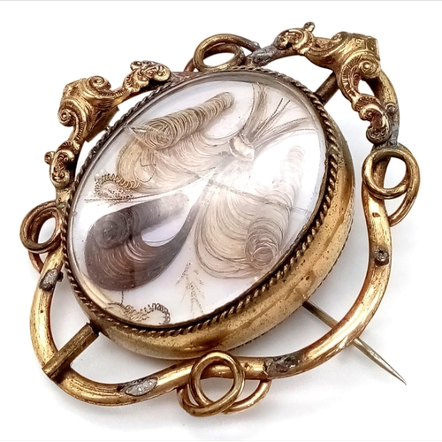 815 - A Victorian Mourning Pendant with Three Different Hair Types. Slight crack in ass. Mounted on mother... 