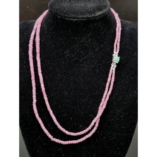 978 - 120ct Two Row Ruby Necklace with emerald Clasp in 925 Silver. 40cm