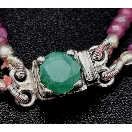 978 - 120ct Two Row Ruby Necklace with emerald Clasp in 925 Silver. 40cm