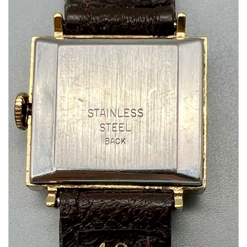 1082 - A Lovely Vintage Timex Ladies Watch. Leather strap with a rectangular gilded case - 25 x 22mm. Mecha... 