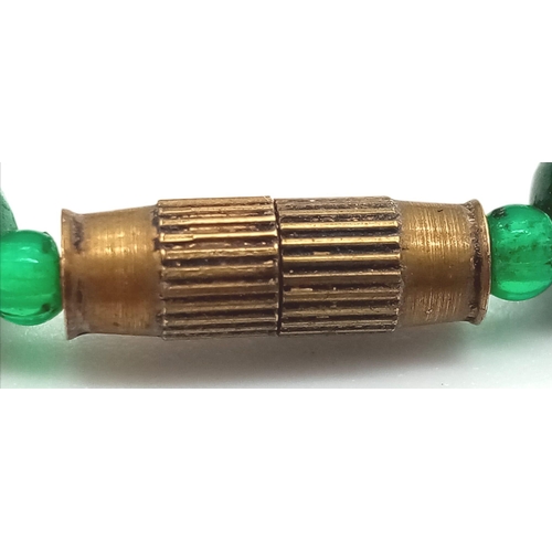 755 - A Vintage Graduated Green Bead Necklace with Barrel Clasp. 46cm.