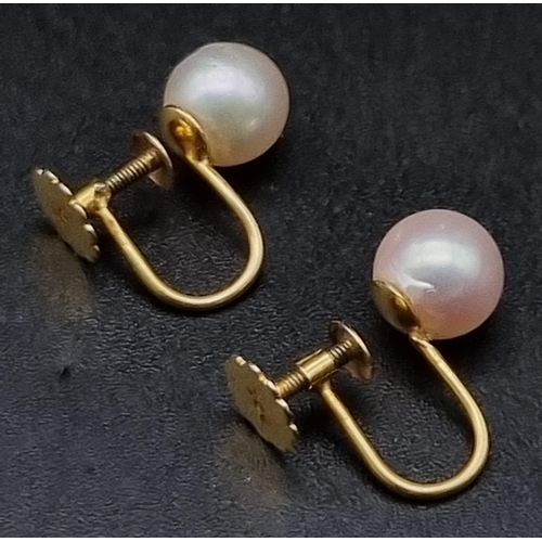 885 - A Pair of 9K Yellow Gold Pearl Earrings with Screw-Back Clasp. 2g total weight.