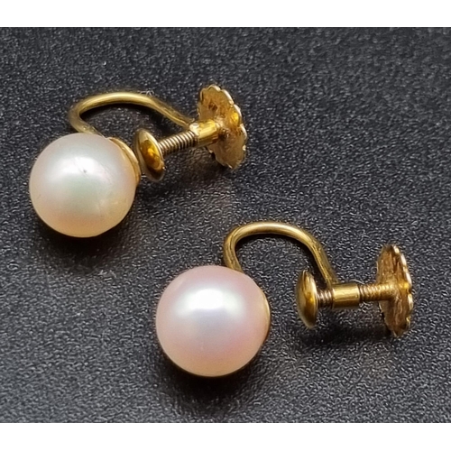 885 - A Pair of 9K Yellow Gold Pearl Earrings with Screw-Back Clasp. 2g total weight.