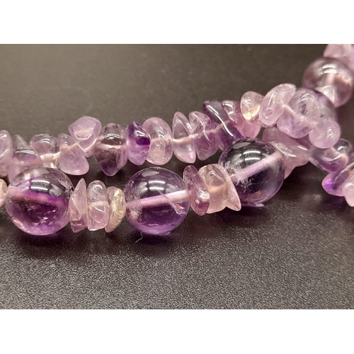 786 - A Mixed Bead-Type Amethyst Necklace. Barrel clasp.
54cm.