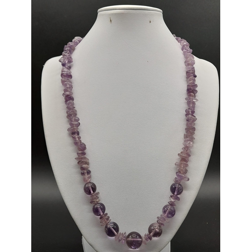 786 - A Mixed Bead-Type Amethyst Necklace. Barrel clasp.
54cm.