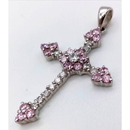 1183 - A 9K White Gold Cross Pendant with Pink Topaz and White Stones. 3.5 x 2.5cm. 4.53g total weight.