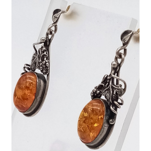 1184 - A Pair of Vintage Silver and Amber Cabochon Earrings.