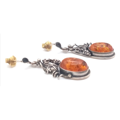 1184 - A Pair of Vintage Silver and Amber Cabochon Earrings.