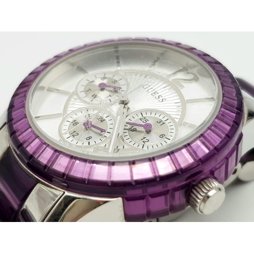 1165 - A Guess Chronograph Ladies Watch. Purple and steel strap and case - 40mm. Quartz movement in working... 