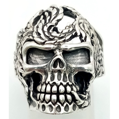 149 - A Solid Silver Skull Ring. Perfect for frightening the neighbours. Size O. 10g.