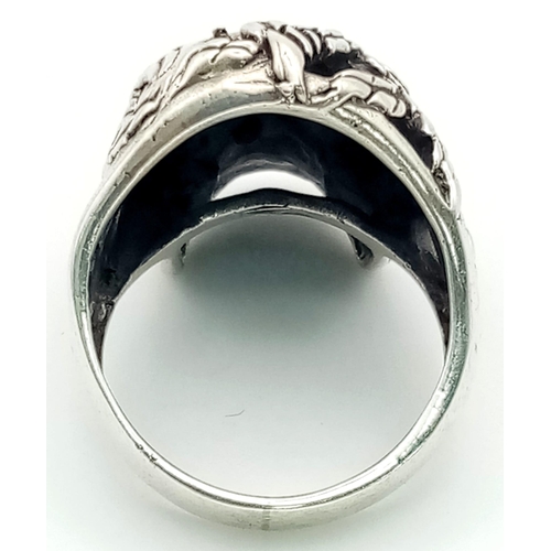 149 - A Solid Silver Skull Ring. Perfect for frightening the neighbours. Size O. 10g.