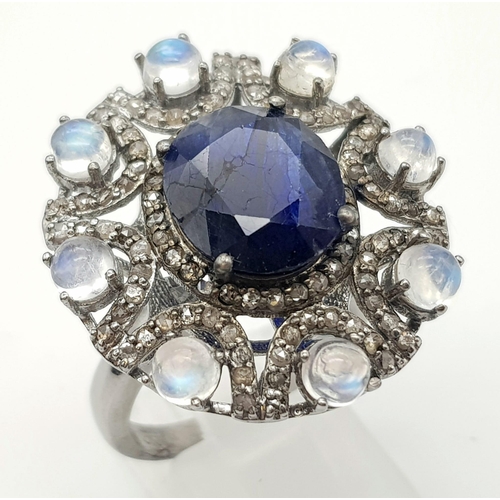 1199 - 6.10ct Blue Sapphire Ring with a 3.15ct Moonstone and 1.10ct Diamonds in a Pave Setting. Size P.