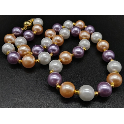 1198 - A Multi-Coloured Cultured Pearl Necklace. Gilded spacers and clasp. 44cm