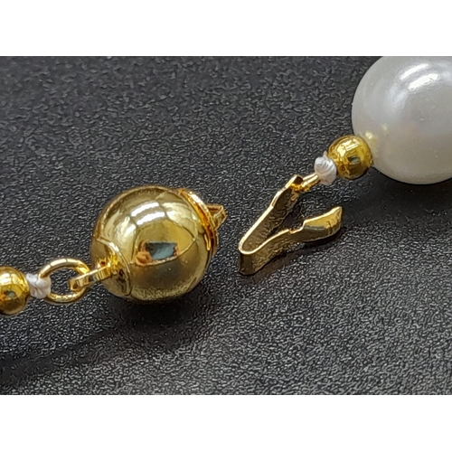 1198 - A Multi-Coloured Cultured Pearl Necklace. Gilded spacers and clasp. 44cm