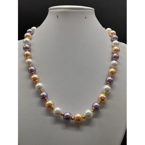 1198 - A Multi-Coloured Cultured Pearl Necklace. Gilded spacers and clasp. 44cm