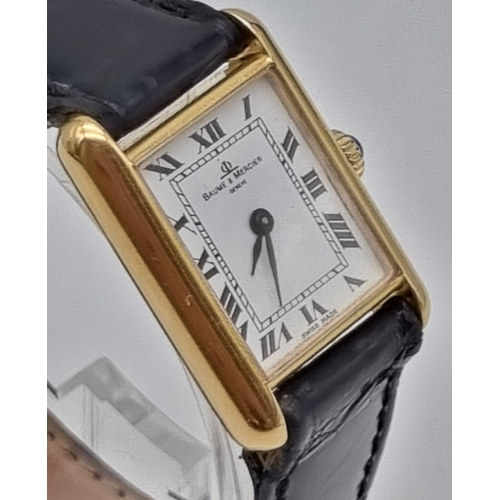 843 - A Baume and Mercier 18K Gold Ladies Tank Watch. Leather strap. 18K gold case - 27 x 22mm. Mechanical... 