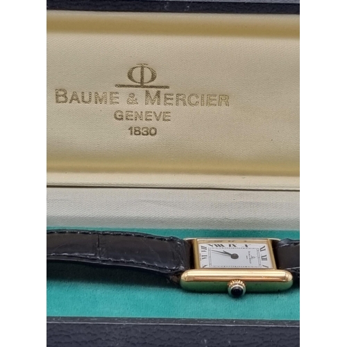 843 - A Baume and Mercier 18K Gold Ladies Tank Watch. Leather strap. 18K gold case - 27 x 22mm. Mechanical... 