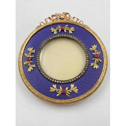 266 - A Russian 14K Yellow Gold Diamond and Enamel Gemset Picture Frame. 7.5cm diameter.
102g total weight... 