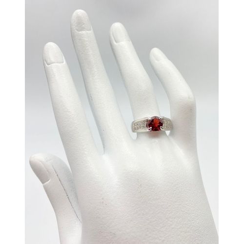 1030 - A Garnet and 925 Silver Ring. Size O. 5g