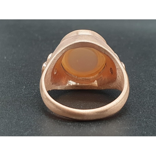 1058 - A 10ct Pearl ring in sterling silver with topaz accents in rose gold finish. ring size R