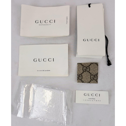 264 - A Gucci GG Supreme Coated (baby care) Canvas Bag. GG monogrammed coated canvas. Features exterior si... 