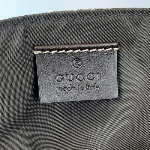 264 - A Gucci GG Supreme Coated (baby care) Canvas Bag. GG monogrammed coated canvas. Features exterior si... 