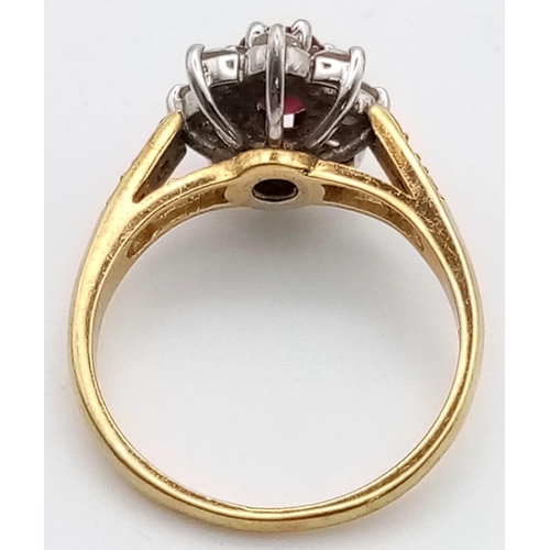 337 - An 18 K yellow gold ring with an oval cut ruby surrounded by a halo of diamonds (0.40 carats). Ring ... 