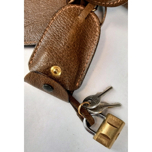 403 - A Gucci Hand Luggage Case. Brown leather with shoulder strap. In good condition but please see photo... 