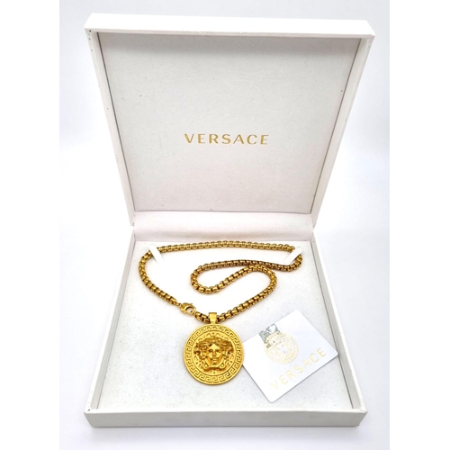 438 - A Gold Plated Versace Statement Necklace and Pendant.
Comes in original Versace presentation case. 6... 