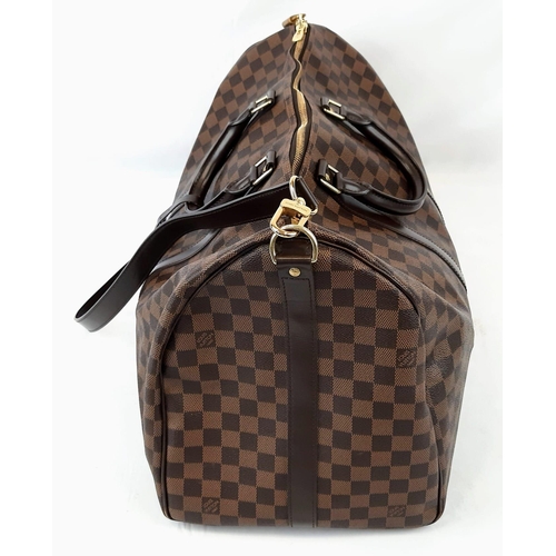 71 - A Louis Vuitton Keepall Bandouliere Travel Bag. Checked canvas design with brown leather and gilded ... 