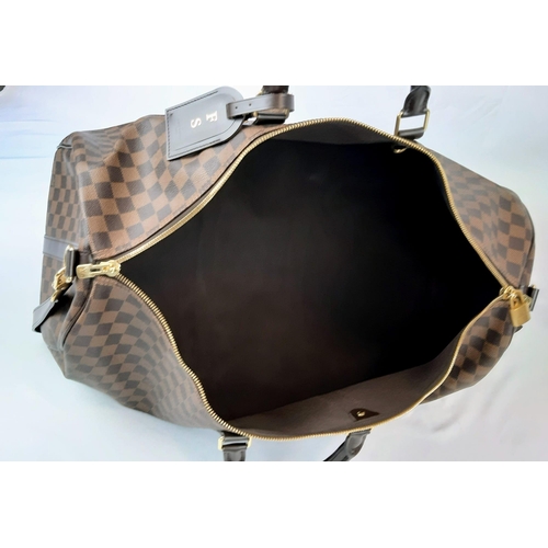 71 - A Louis Vuitton Keepall Bandouliere Travel Bag. Checked canvas design with brown leather and gilded ... 