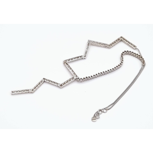 85 - A Unique 18K White Gold Diamond Zig-Zag Necklace. On one side 36 quality small round cut diamonds - ... 