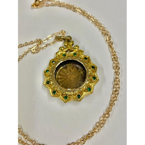 1137 - Antique yellow metal & green stone photo locket on plated chain