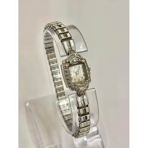 423 - Vintage 14ct gold cocktail watch ( white gold ), ticks , on plated strap