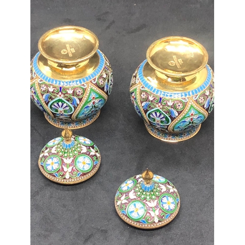 554 - A PAIR of Russian silver enamel lidded urn/caddys Height 10.6cm Diameter 6.6cm Weight 295 for the pa... 